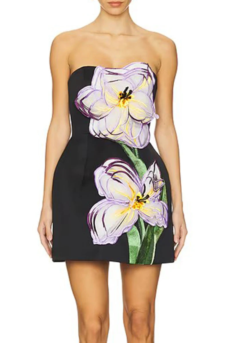 Woman wearing a strapless dress with floral design on a white background