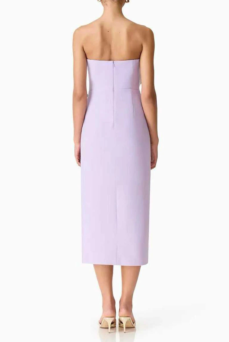 Lavender strapless dress worn by a model on a white background