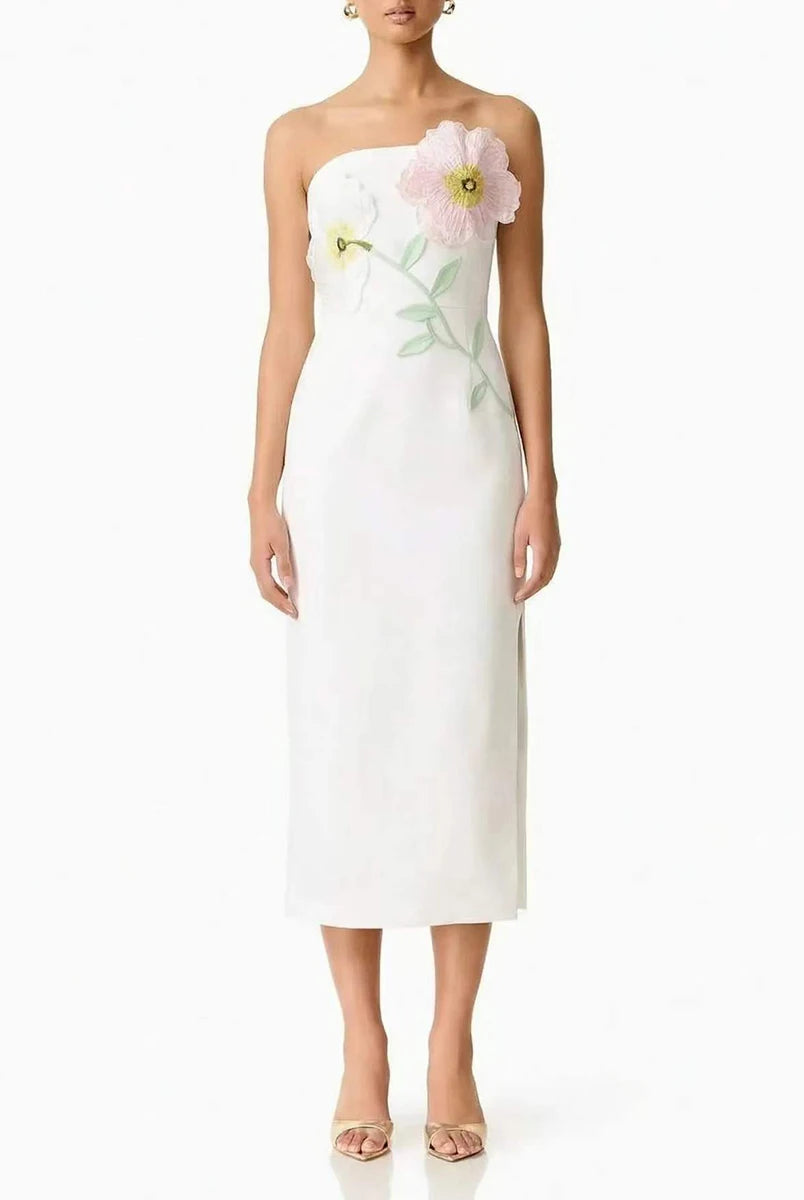 White strapless dress with floral embroidery on a white background