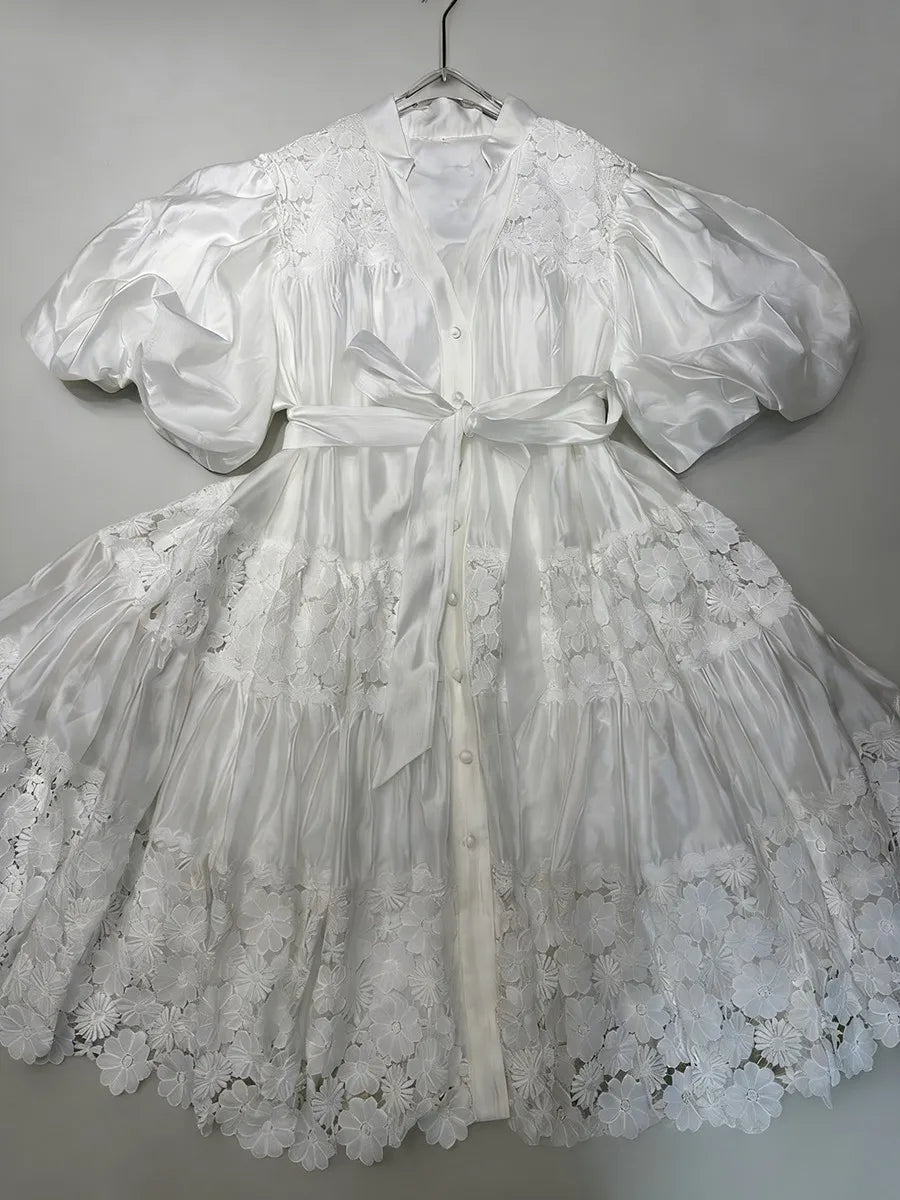 "White tie-waist mini dress - side profile showing A-line silhouette"