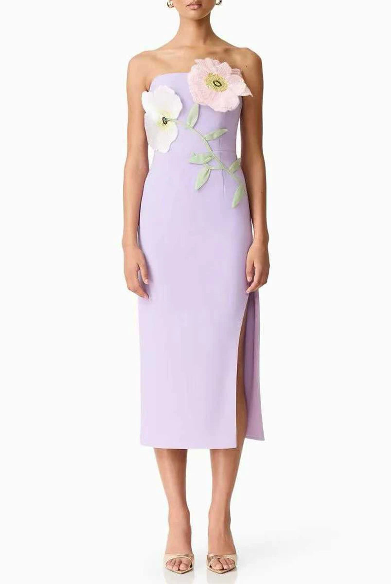 Lavender strapless dress with floral embellishments on a white background
