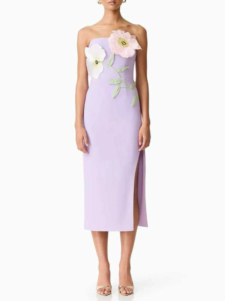 Lavender strapless dress with floral embellishments on a white background