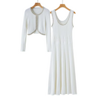 A matching two-piece women's outfit set hanging on wooden hangers against a plain white background. The set includes a sleeveless white ribbed maxi dress with decorative beaded trim along the scoop neckline and a matching cropped open-front cardigan with long sleeves and beaded trim along the edges.