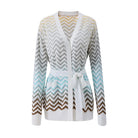 A women's long-sleeve knit cardigan with a V-neck and self-tie belt, featuring a chevron pattern that transitions from white and gray at the top to light blue and brown at the bottom, shown on a plain white background.