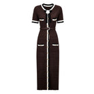 A dark brown textured knit midi dress with short sleeves, featuring white and black trim, gold-tone buttons, and a matching belt with a gold buckle.
