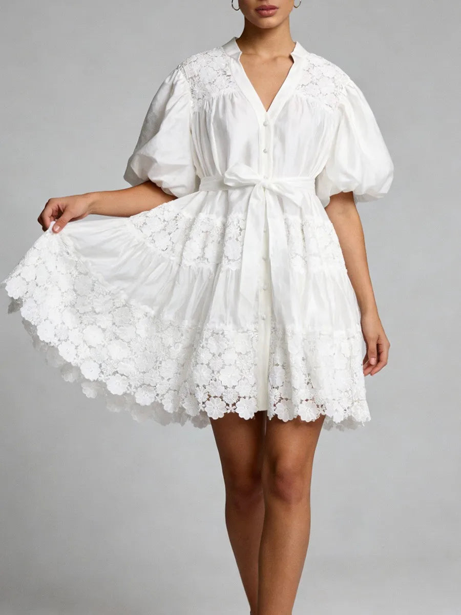 "White lace puff sleeve mini dress with tie waist - front view on model"