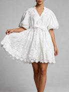 "White lace puff sleeve mini dress with tie waist - front view on model"