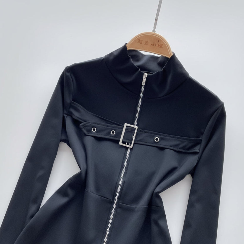 Black bodysuit with a zipper and buckle on a hanger against a white background