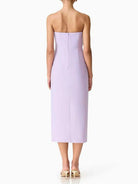 Lavender strapless dress worn by a model on a white background