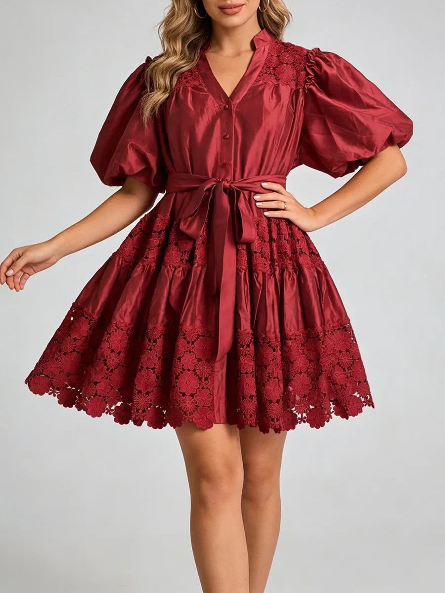 "Elegant lace mini dress detail - romantic puff sleeves and V-neck neckline"